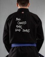 Bad Choices Make Good Stories embroidery on the back of a black BJJ Gi