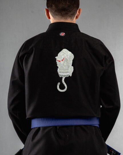 Caged embroidery on the back of a black BJJ Gi