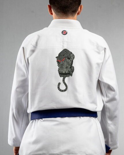 Caged embroidery on the back of a white BJJ Gi
