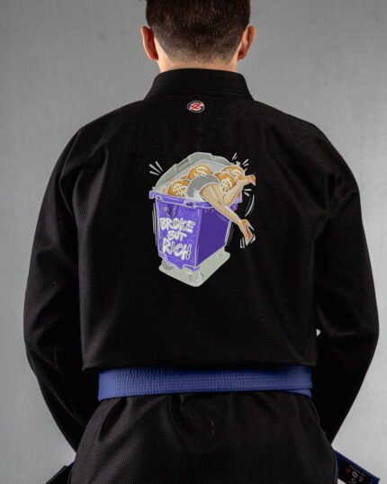 Broke But Rich embroidery on the back of a black BJJ Gi