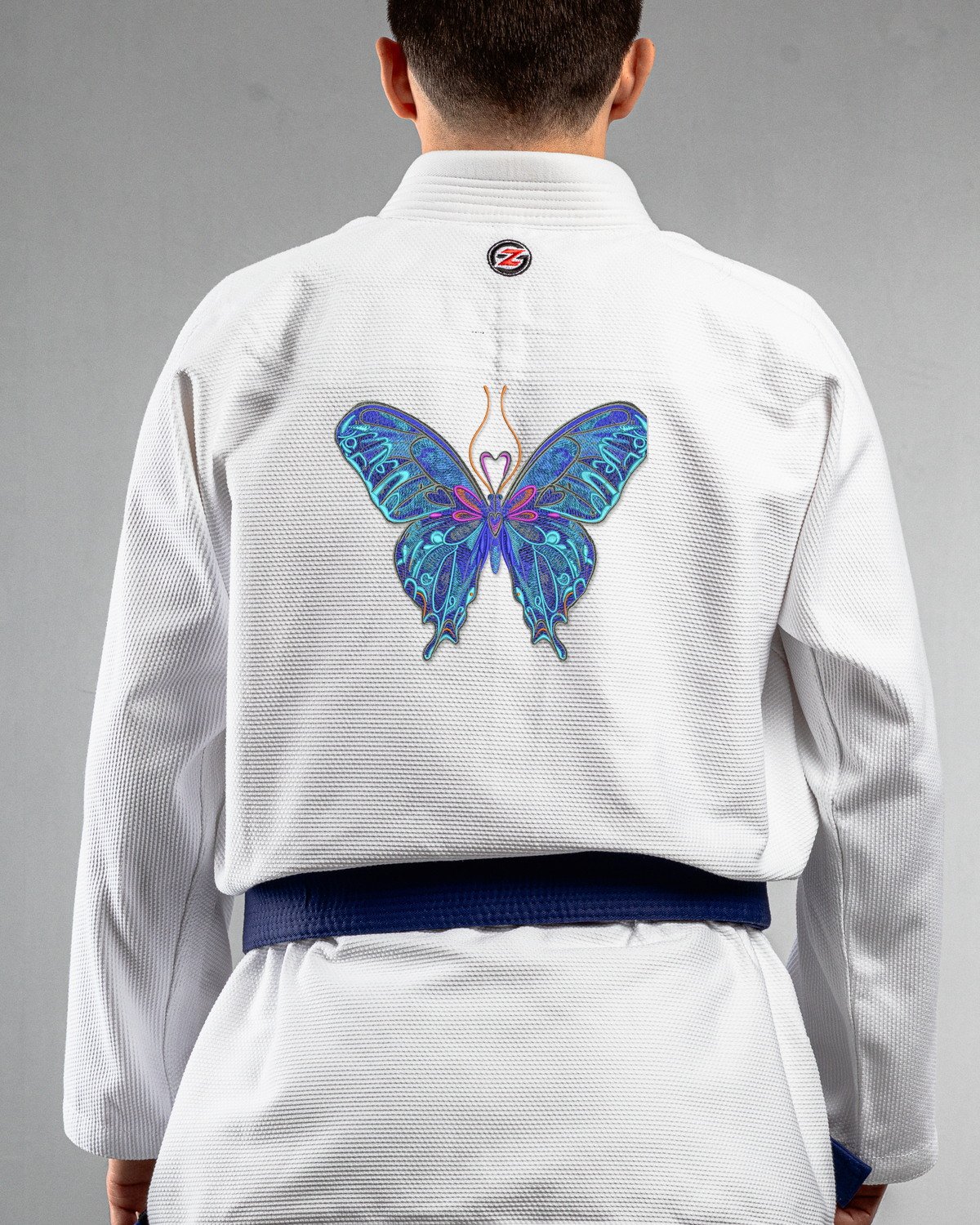 Butterfly 3 white Gi back mockup Butterfly 3 embroidery on the back of a white BJJ Gi