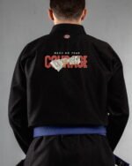 Courage embroidery on the back of a black BJJ Gi