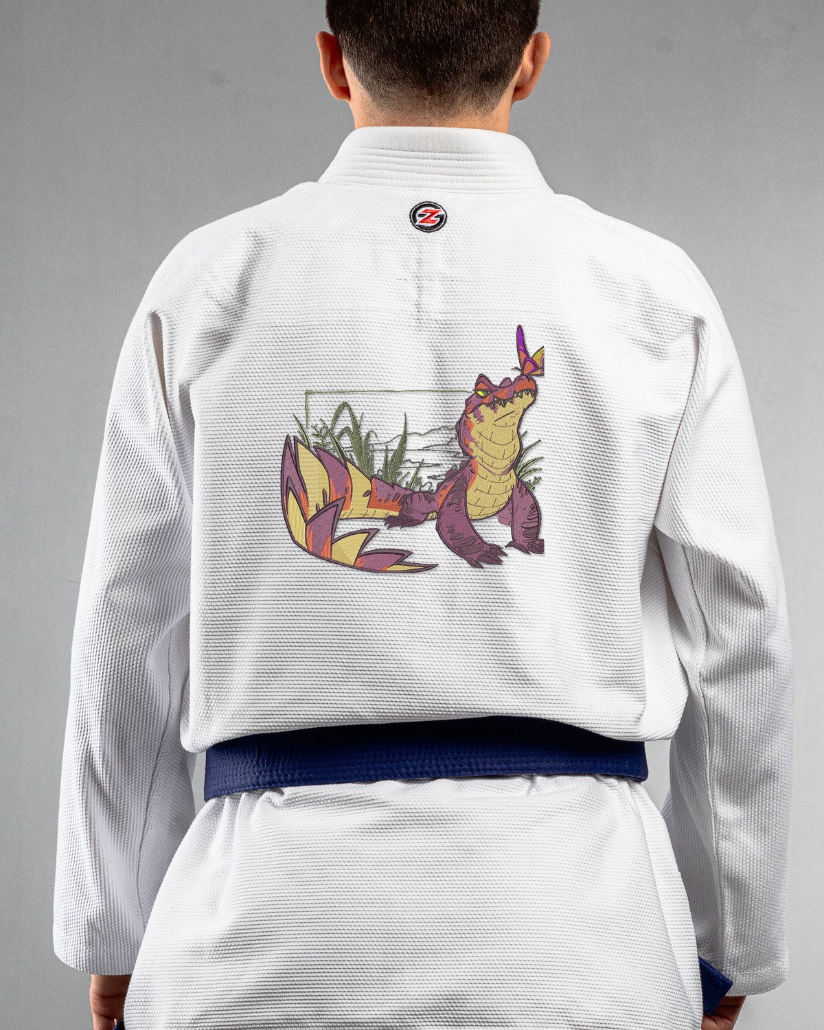 Crocodile white Gi back mockup Crocodile embroidery on the back of a white BJJ Gi