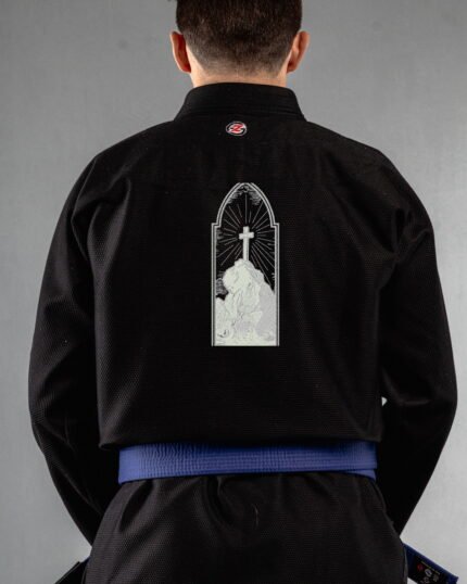 Cross embroidery on the back of a black BJJ Gi