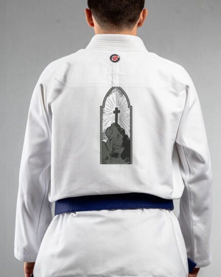 Cross embroidery on the back of a white BJJ Gi