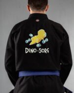 Dino Sore embroidery on the back of a black BJJ Gi