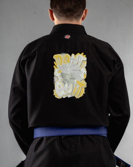 Dont Quite embroidery on the back of a black BJJ Gi