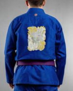 Dont Quite embroidery on the back of a blue BJJ Gi