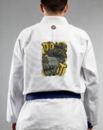 Dont Quite embroidery on the back of a white BJJ Gi