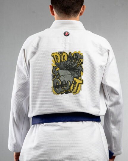 Dont Quite embroidery on the back of a white BJJ Gi