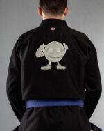 Doodles embroidery on the back of a black BJJ Gi