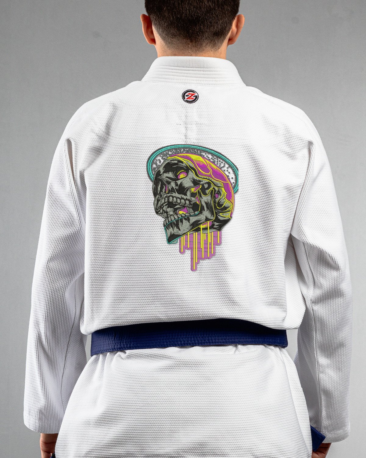 Dripping Skull white Gi back mockup Dripping Skull embroidery on the back of a white BJJ Gi