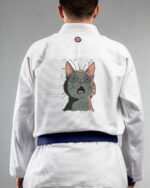 Eat What embroidery on the back of a white BJJ Gi