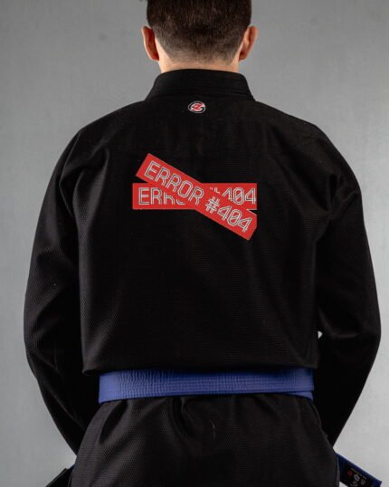 Error embroidery on the back of a black BJJ Gi