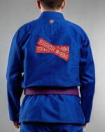 Error embroidery on the back of a blue BJJ Gi