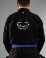 Face (10) Files embroidery on the back of a black BJJ Gi