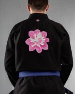 Petals & Wings embroidery on the back of a black BJJ Gi