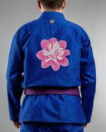 Petals & Wings embroidery on the back of a blue BJJ Gi