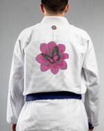 Petals & Wings embroidery on the back of a white BJJ Gi
