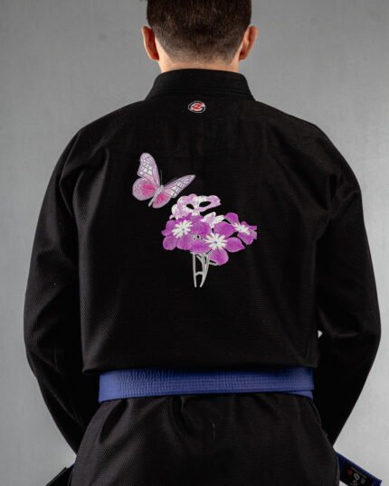 Butterfly Bloom embroidery on the back of a black BJJ Gi