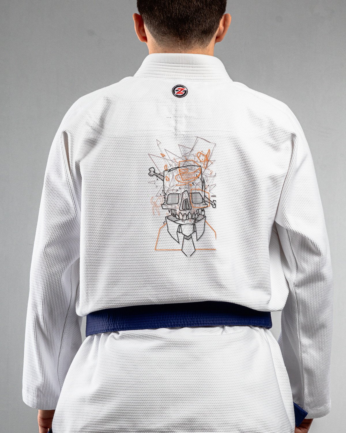 Glitched Skull white Gi back mockup Glitched Skull embroidery on the back of a white BJJ Gi