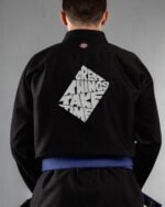 Great Things Take Time embroidery on the back of a black BJJ Gi