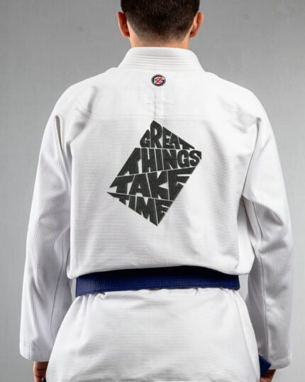 Great Things Take Time embroidery on the back of a white BJJ Gi