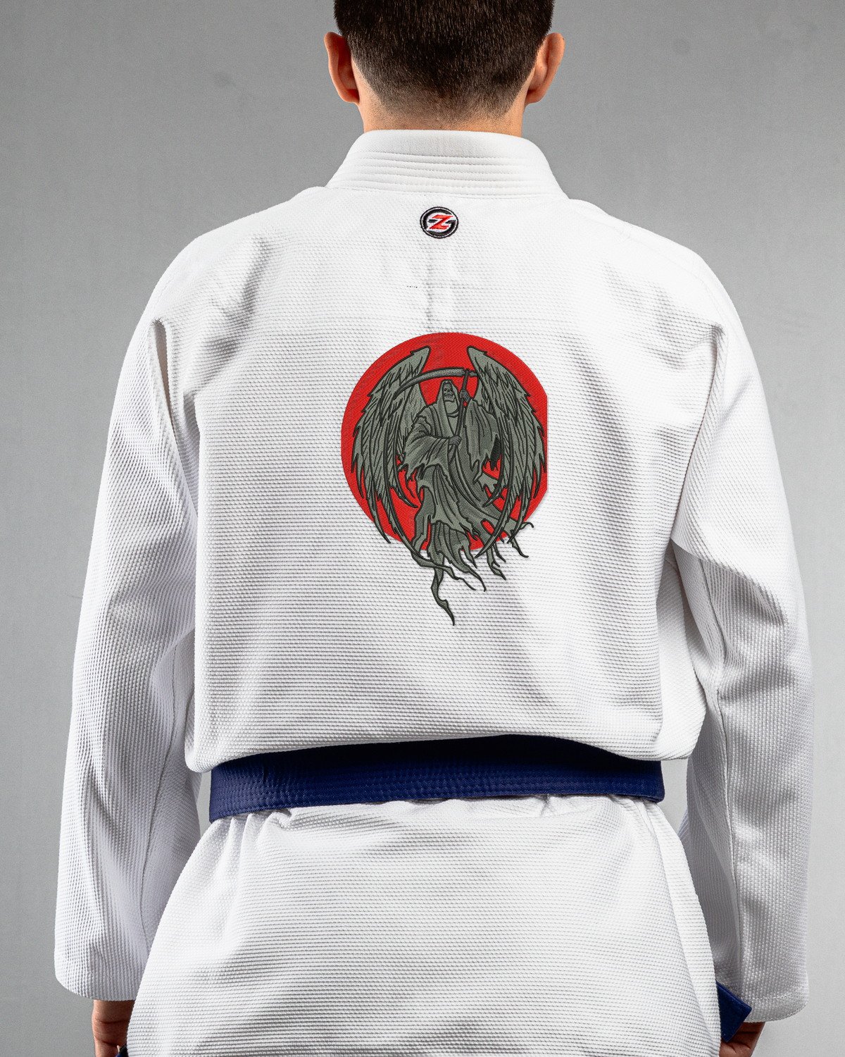 Grim Reaper white Gi back mockup Grim Reaper embroidery on the back of a white BJJ Gi
