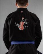 Violin embroidery on the back of a black BJJ Gi