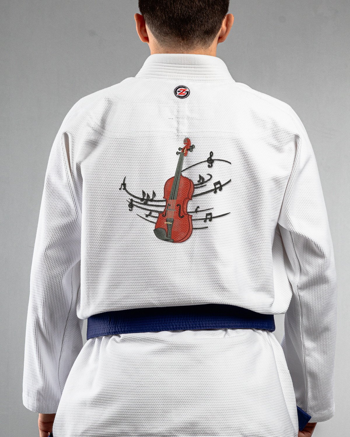 Violin white Gi back mockup Violin embroidery on the back of a white BJJ Gi