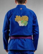 Hustle embroidery on the back of a blue BJJ Gi