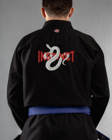 Instinct embroidery on the back of a black BJJ Gi