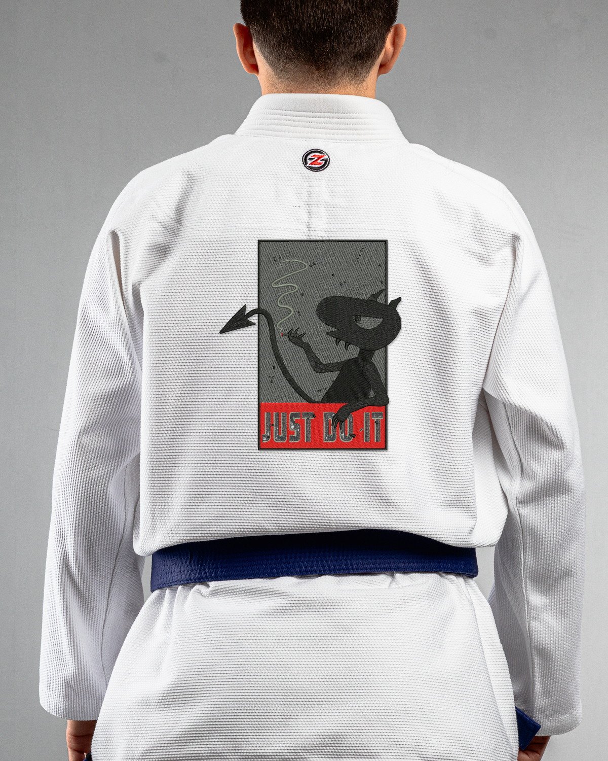 Just Do It white Gi back mockup Just Do It embroidery on the back of a white BJJ Gi
