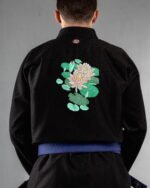 Lotus embroidery on the back of a black BJJ Gi