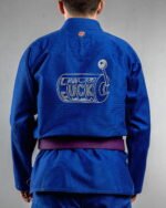 Luck embroidery on the back of a blue BJJ Gi