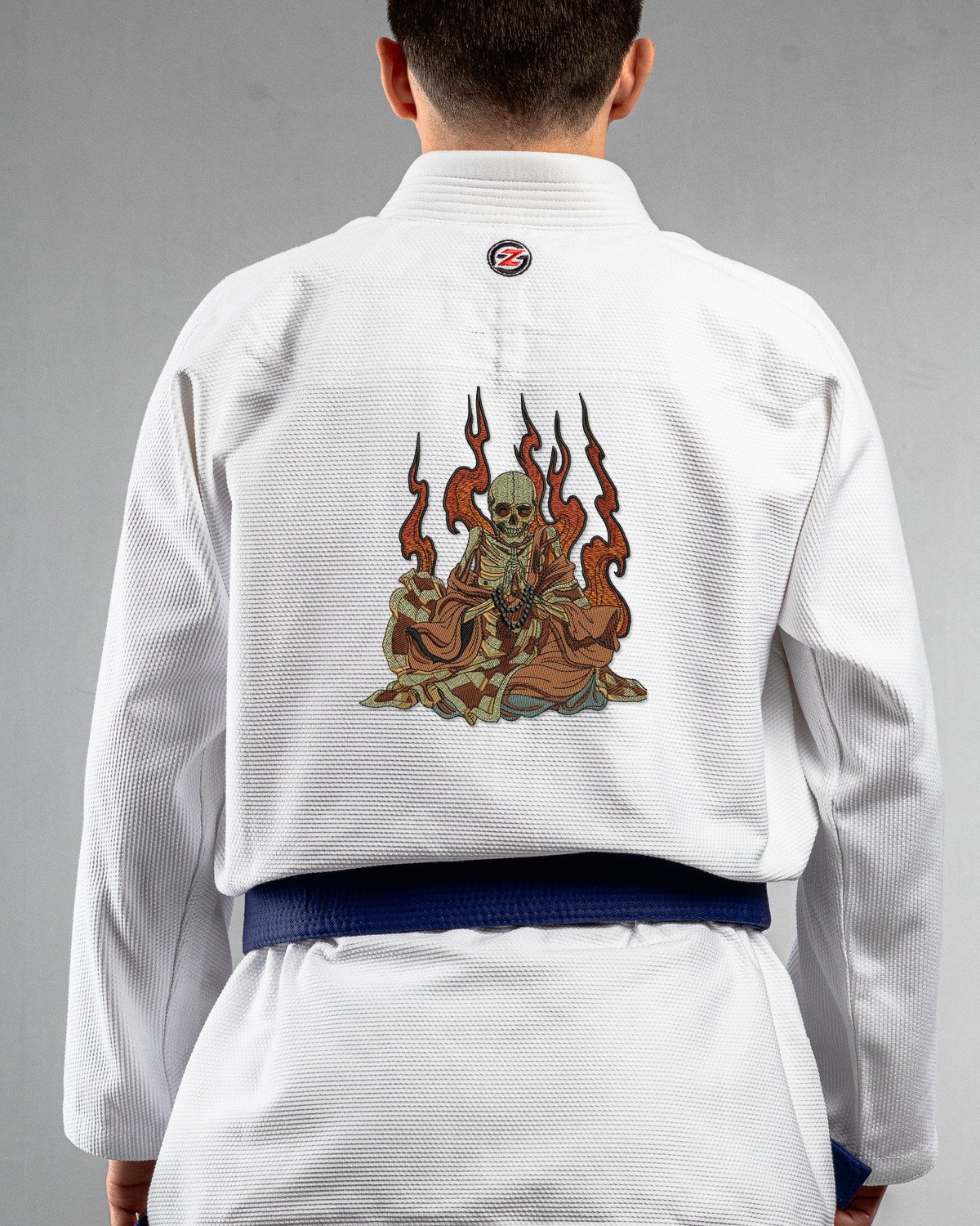 Meditate white Gi back mockup Meditate embroidery on the back of a white BJJ Gi