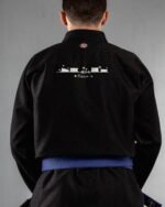 Meow (minimal) embroidery on the back of a black BJJ Gi