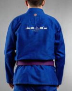 Meow (minimal) embroidery on the back of a blue BJJ Gi