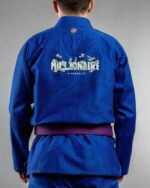 Millionaire In Progree embroidery on the back of a blue BJJ Gi
