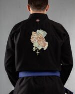 Money & Faith embroidery on the back of a black BJJ Gi