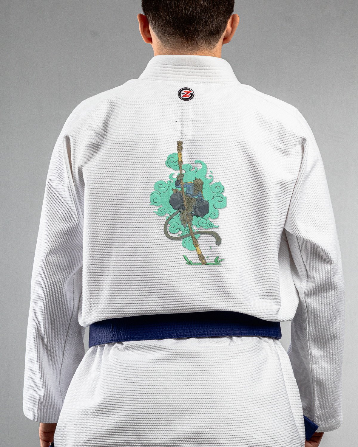 Monkey King white Gi back mockup Monkey King embroidery on the back of a white BJJ Gi