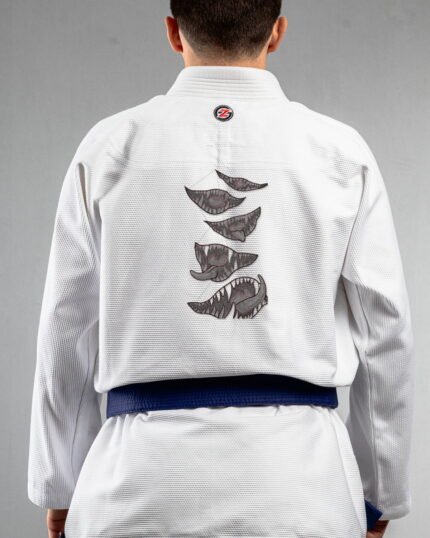 Monster Mouth embroidery on the back of a white BJJ Gi