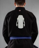 Monster embroidery on the back of a black BJJ Gi