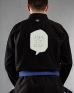 Nah,i'd Win embroidery on the back of a black BJJ Gi