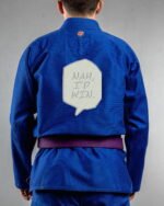 Nah,i'd Win embroidery on the back of a blue BJJ Gi