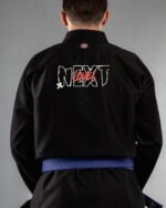 Next Level embroidery on the back of a black BJJ Gi