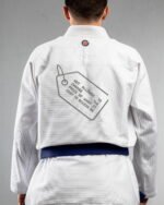 Not Allowed To Change The Price embroidery on the back of a white BJJ Gi