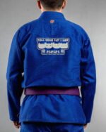 Tell Your Cat I Said Pspsps!! embroidery on the back of a blue BJJ Gi