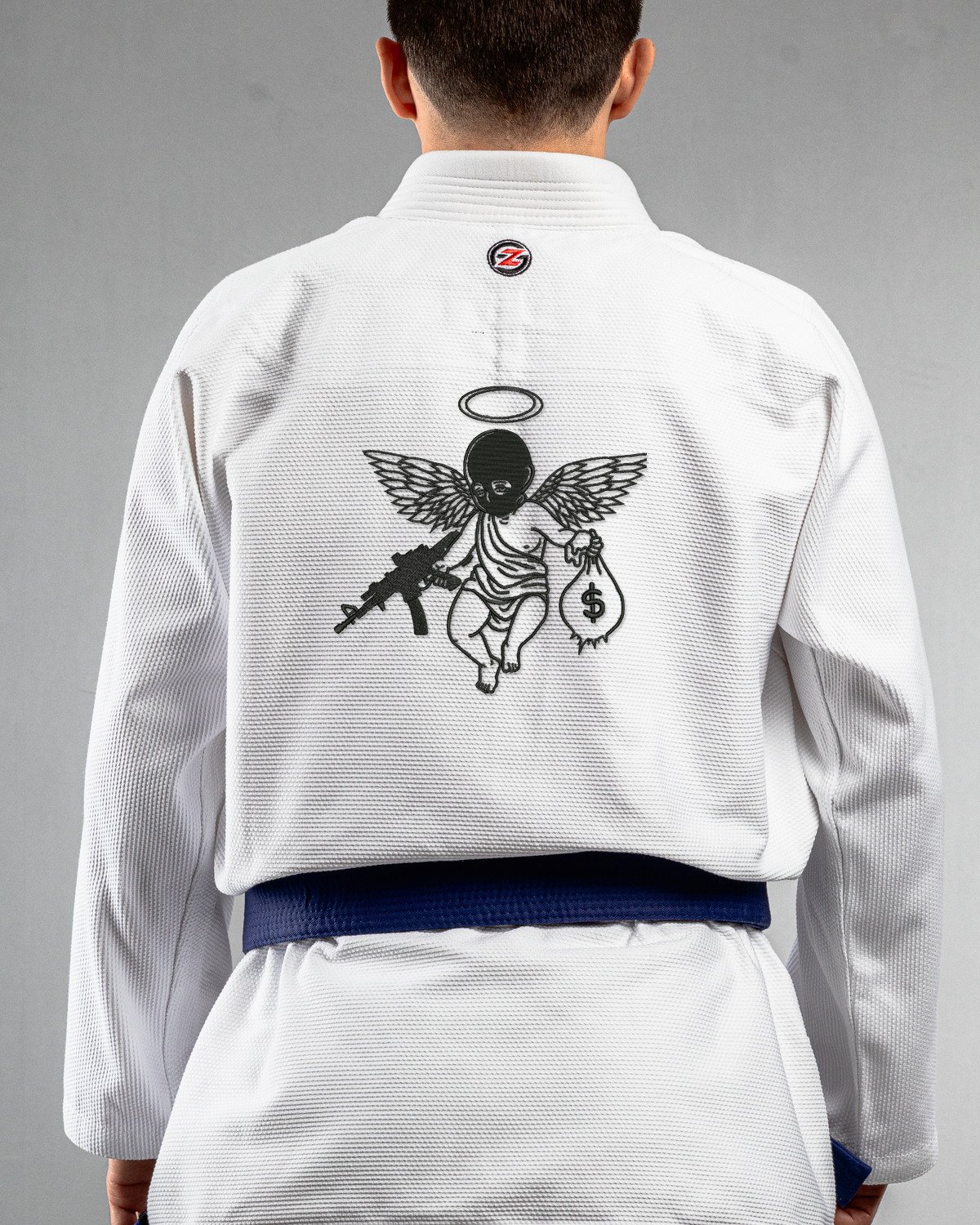 Saint Sin white Gi back mockup Saint Sin embroidery on the back of a white BJJ Gi