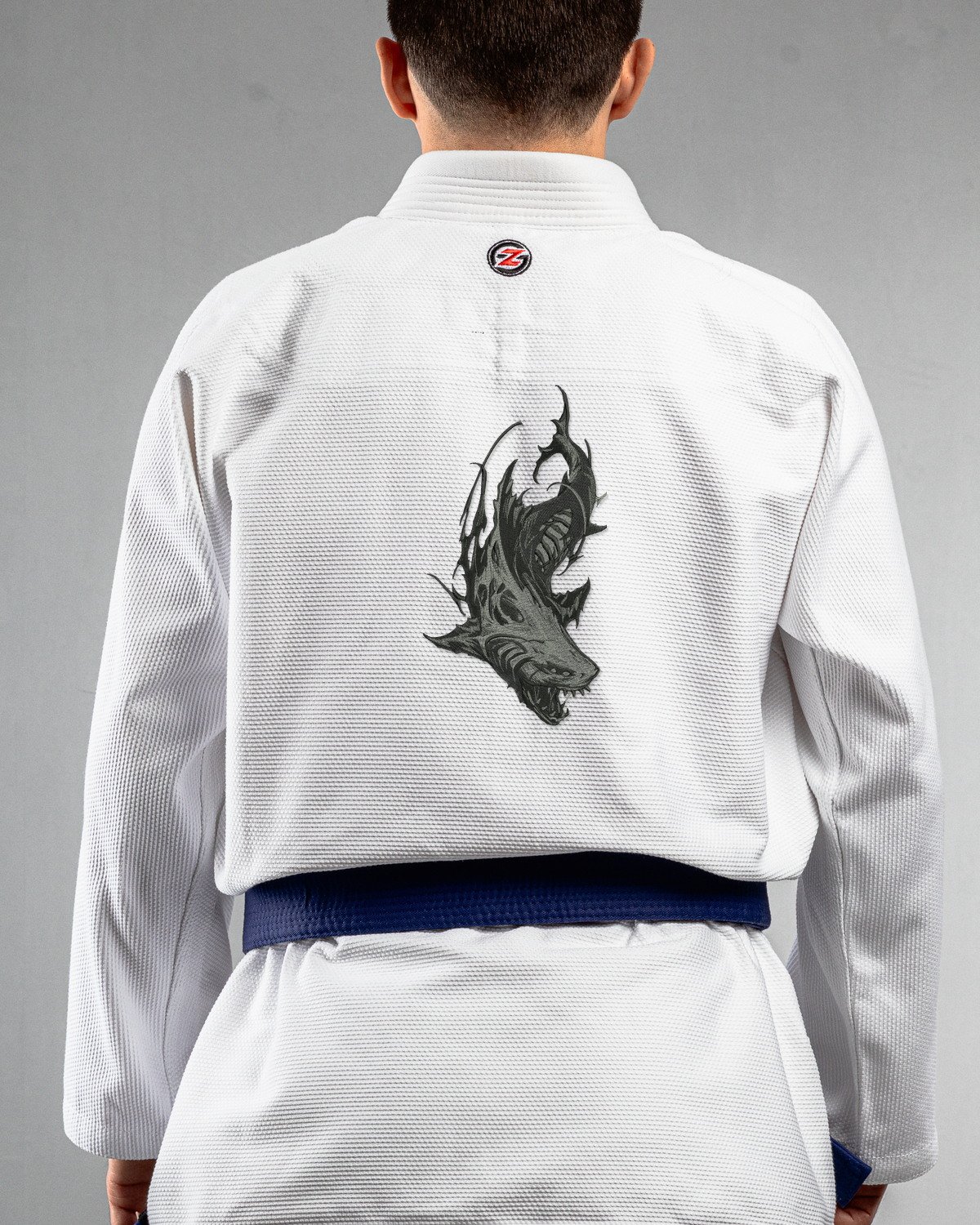 Shark white Gi back mockup Shark embroidery on the back of a white BJJ Gi